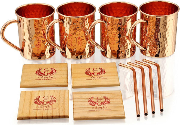 Gift Set Pure Copper Hammered Mugs with Copper Straws & Wooden Coasters Set of 4 - PREMIUM QUALITY -16 Oz Copper Mug - 100% Handcrafted - A Gift Pack for your loved Ones.